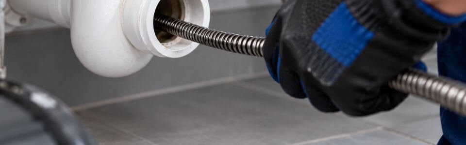 Plumber performing drain cleaning service in Denton, TX